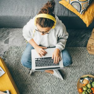 Young woman using laptop computer at home.